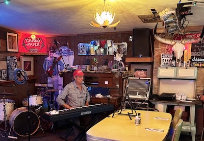 Johnny Nicholas at the Hill Top Cafe sound-checking his keyboard.