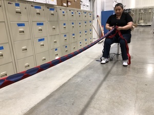 Cristina Winston braids ribbon for the ITC's team mum.