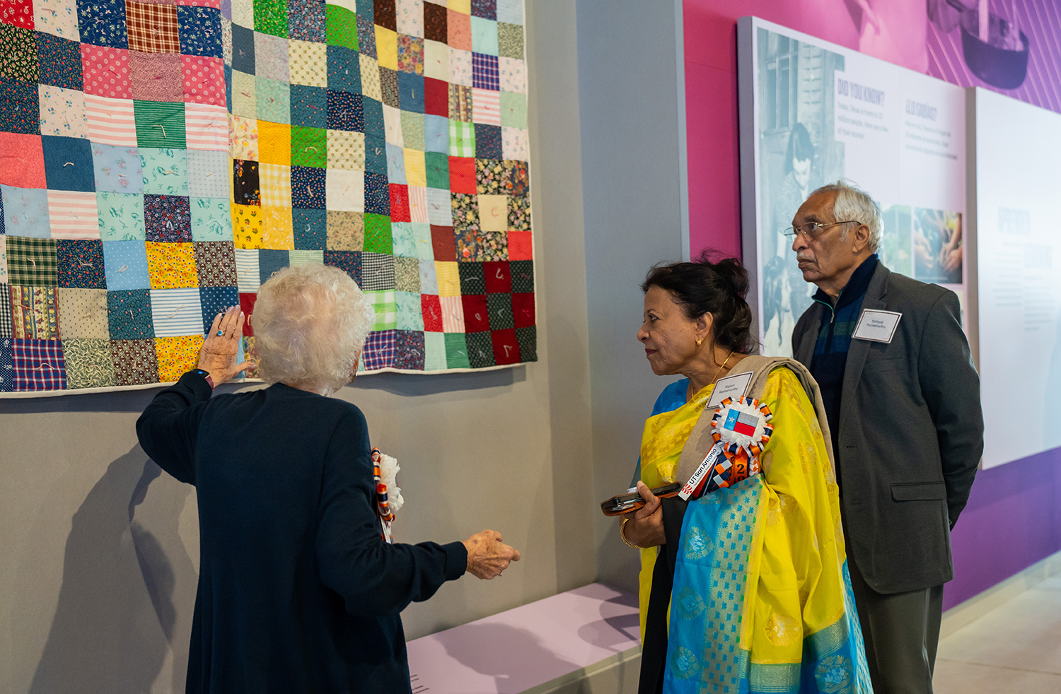 ITC docent Joanne Duming greets Dr. Rajam Ramamurthy and her husband at the ITC opening.