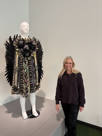 Professional mum maker Kara Palmer and her award-winning Game of Thrones-themed homecoming mum on display at the ITC.