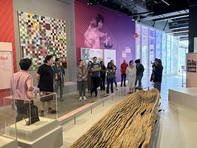 Monica Perales, associate vice provost for the Institute of Texan Cultures, leads students from a UTSA Public History class through the new ITC exhibit floor. Perales explained the institute&rsquo;s history and the process of its evolution to new exhibits and ways of storytelling. 