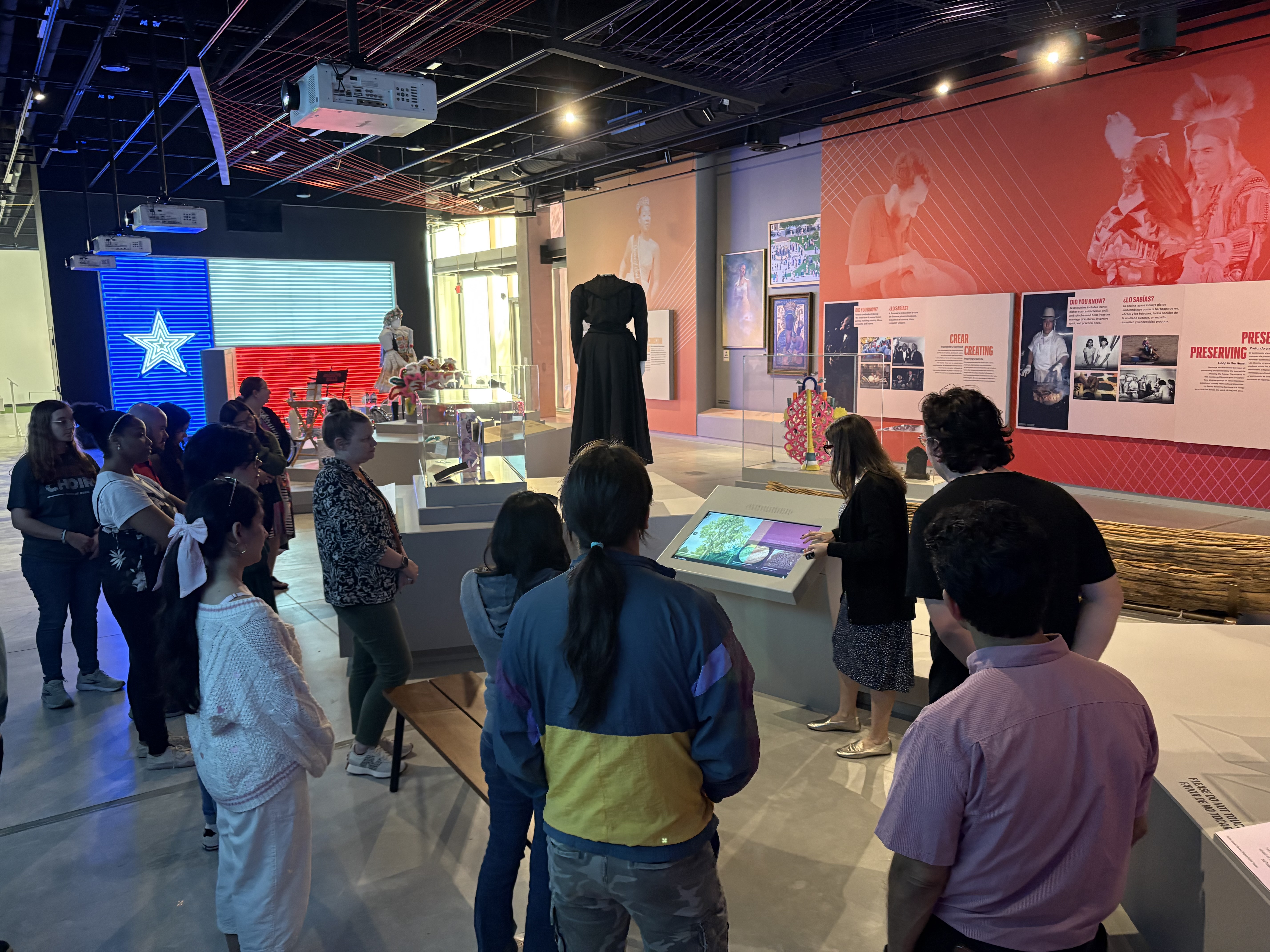 Monica Perales, associate vice provost for the Institute of Texan Cultures, explains to a UTSA public history class how the institute&rsquo;s new exhibit floor incorporates interactive technology and digital experiences, adding depth to the museum experience. 