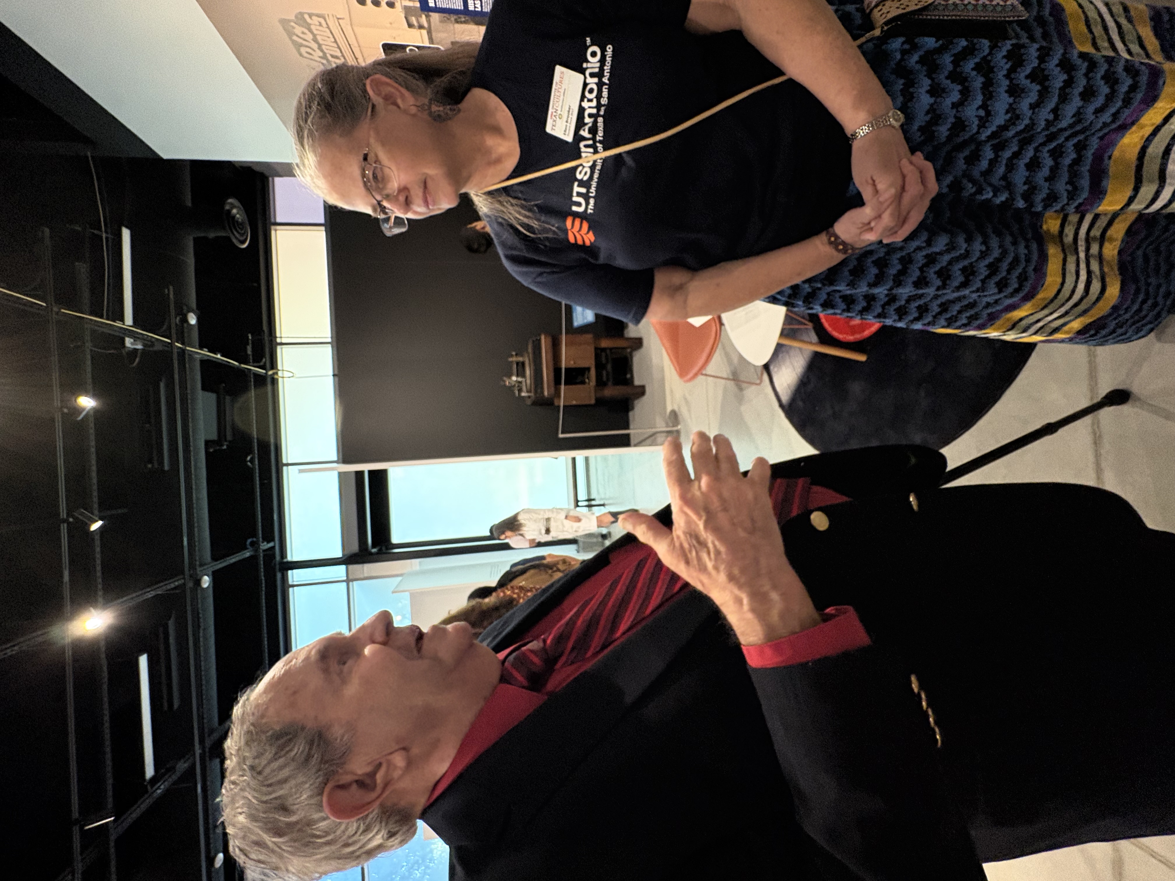 Clay Shorkley from the Texas Music Museum with ITC docent Ellen Brooker in the exhibit talking
