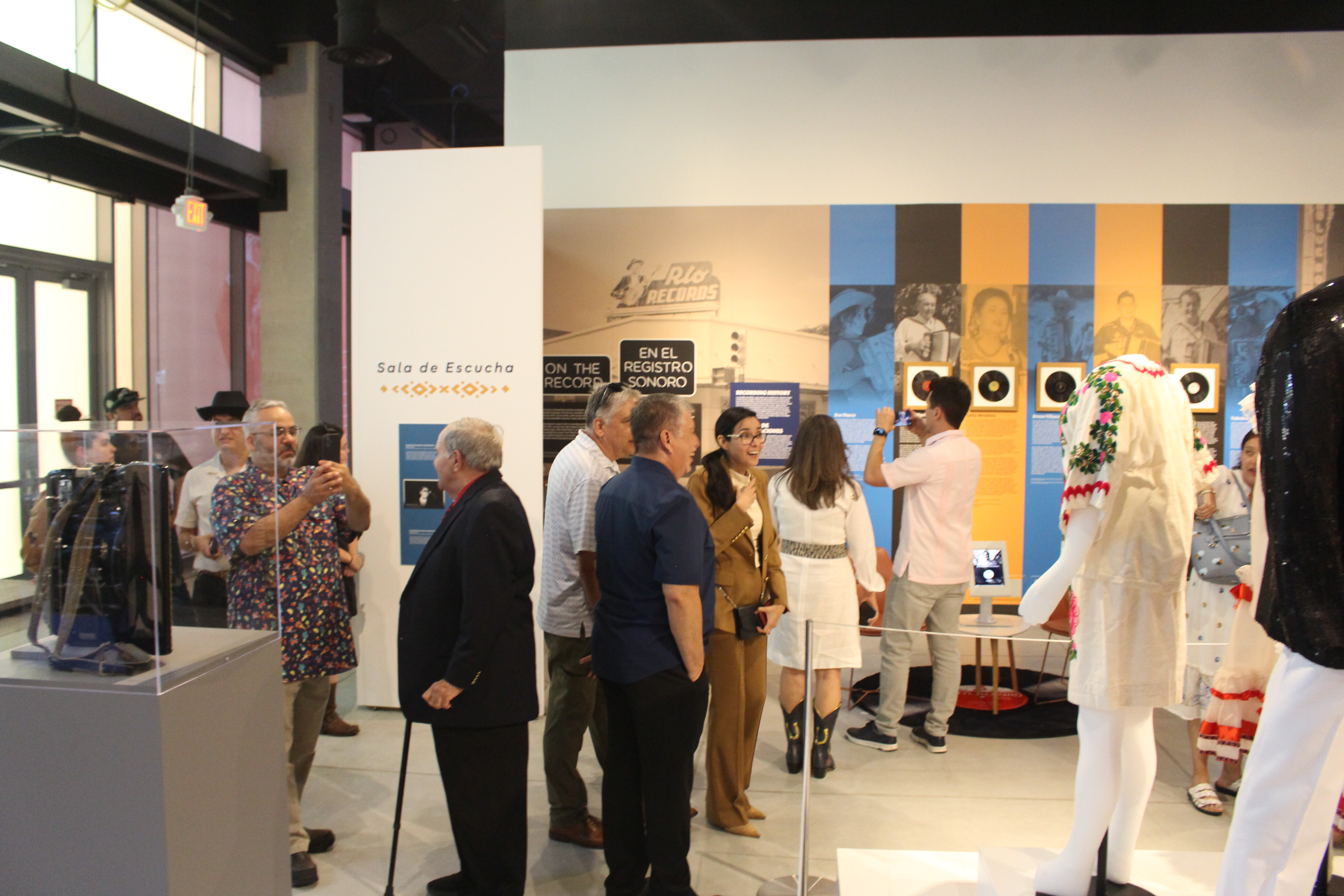 60 friends of the Institute of Texan Cultures gathered for the Puro Conjunto exhibit opening.