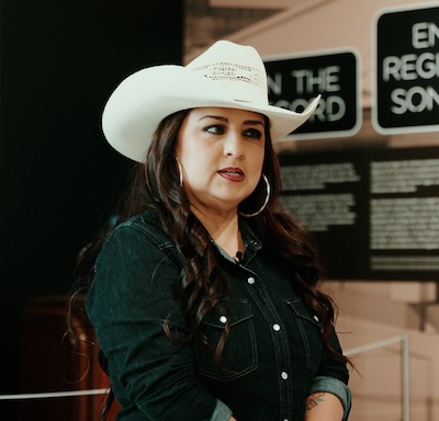 Tejano star Shelly Lares visits the “Puro Conjunto” exhibit at the Institute of Texan Cultures.